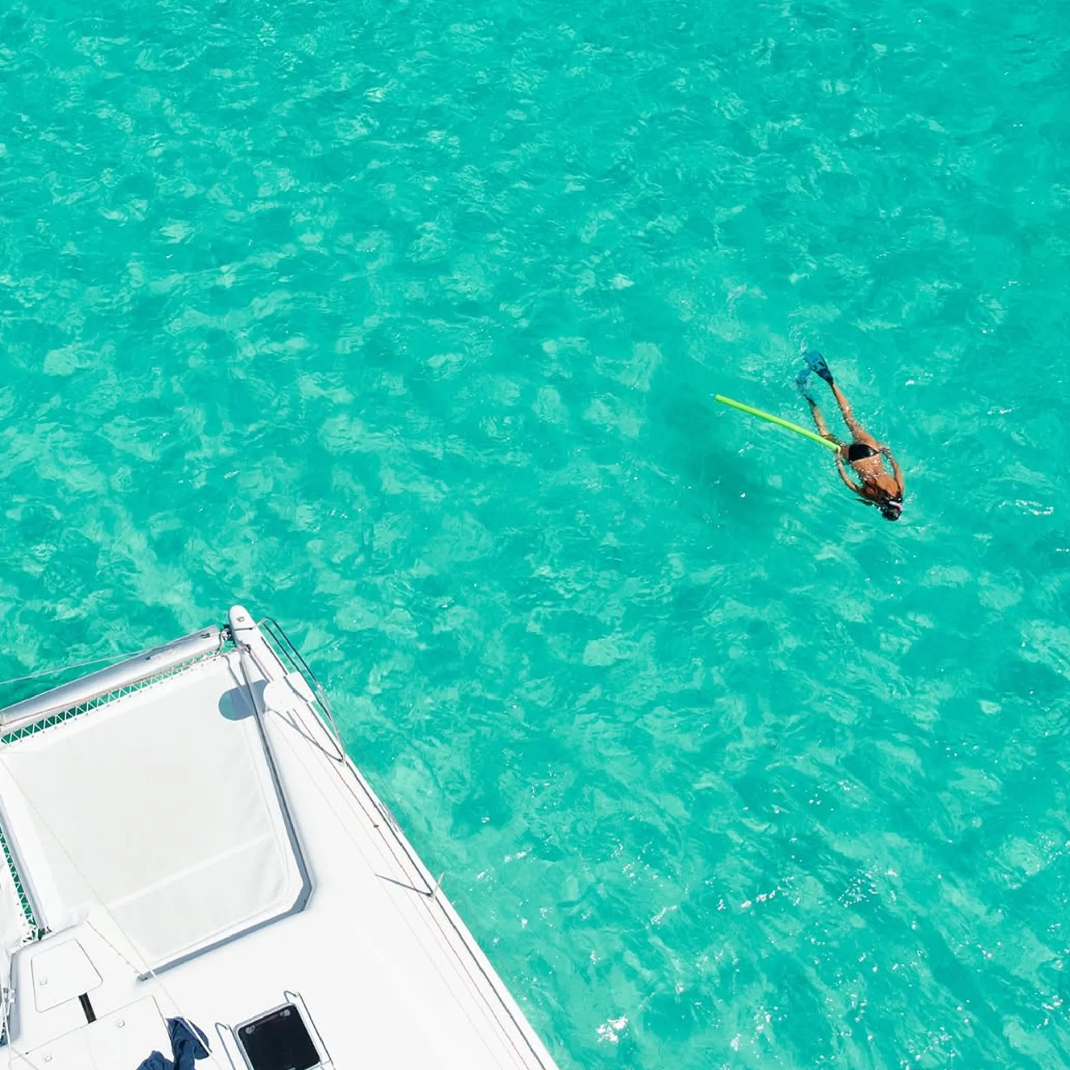 snorkeling near boat in clear water