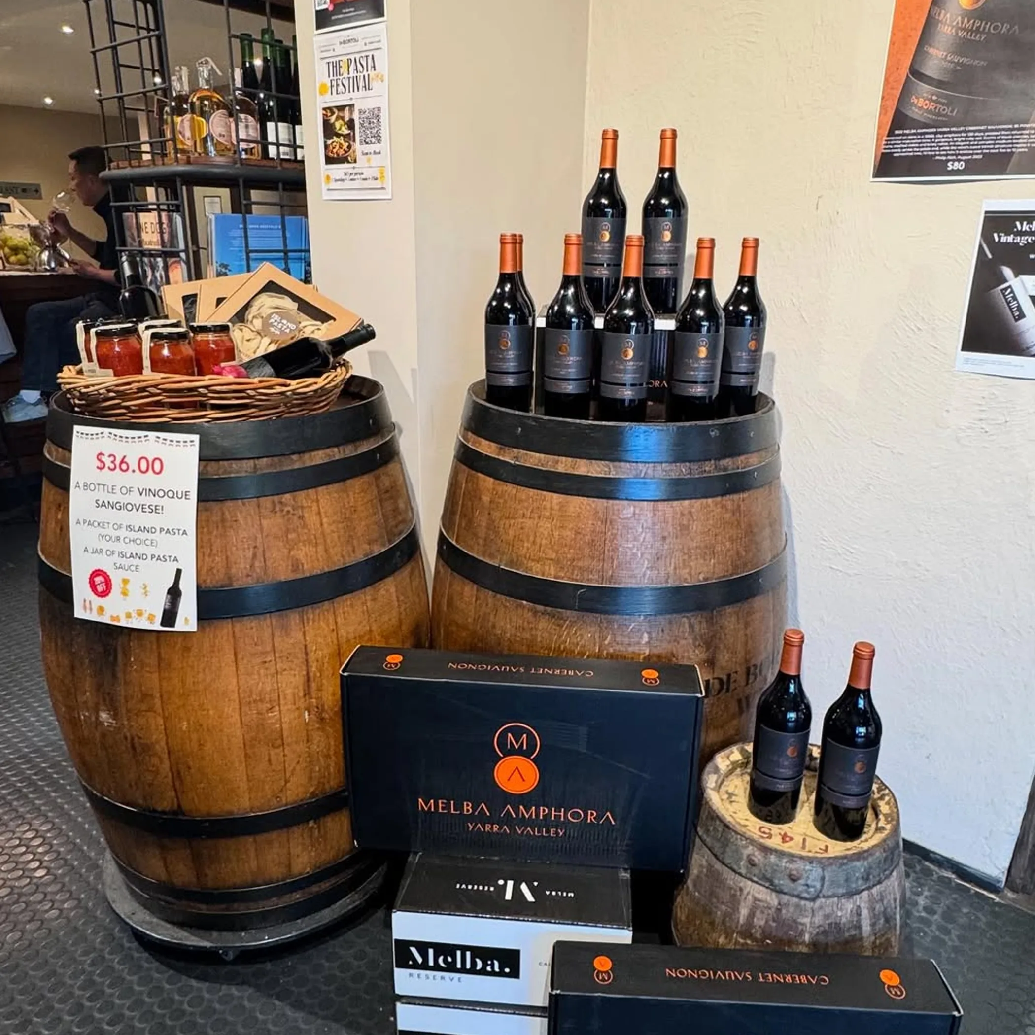 wine bottles and barrels at australian winery