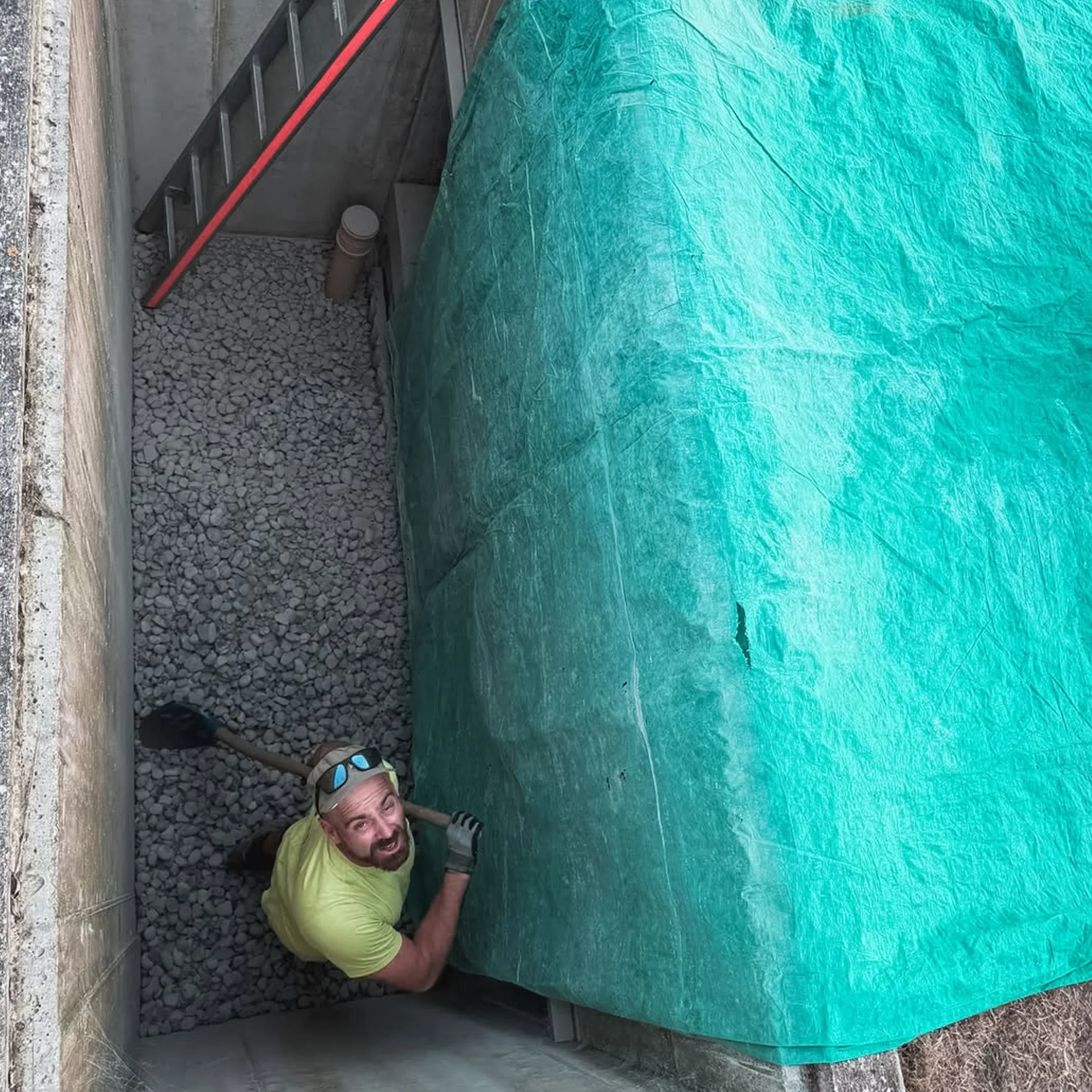 hands-on drainage work in light well