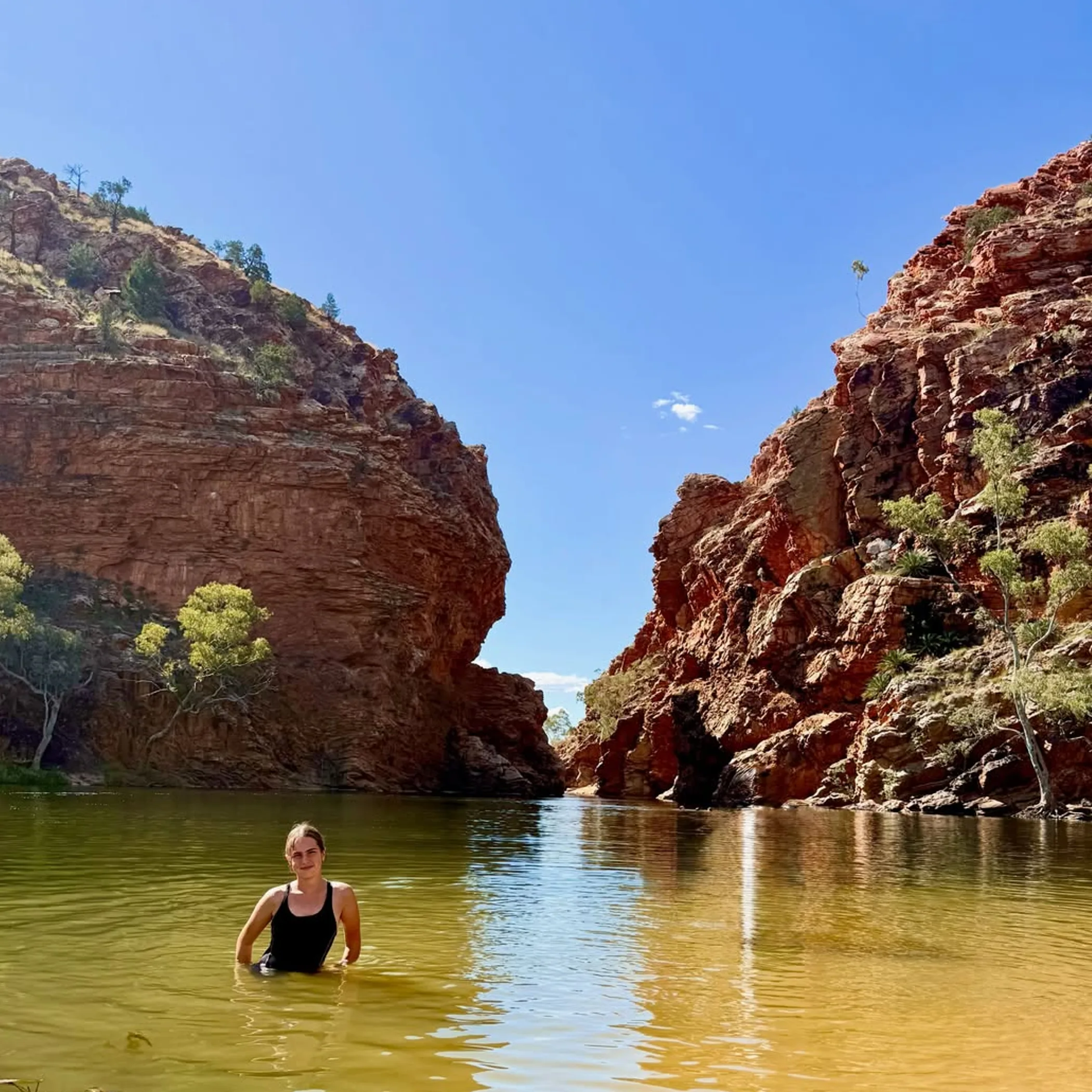 red cliffs and water
